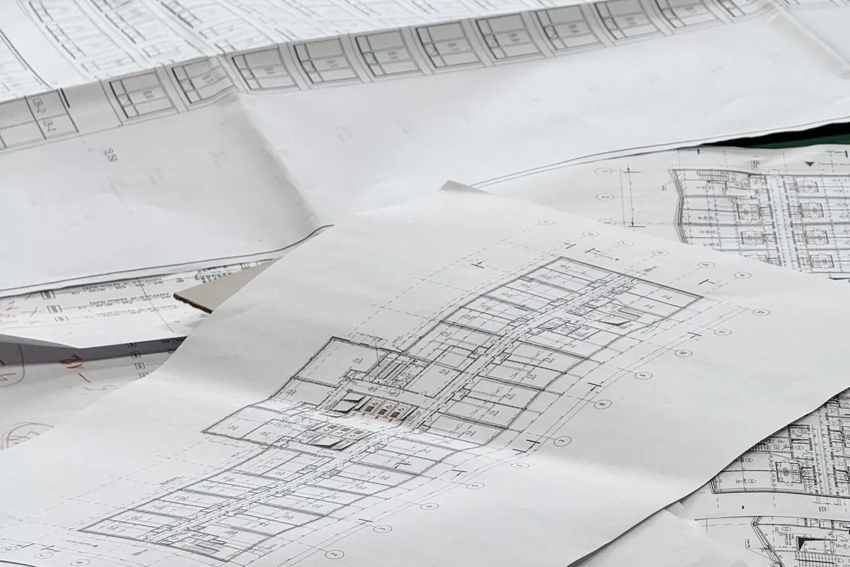 Rolled architectural drawings of the kind a plan check reviews